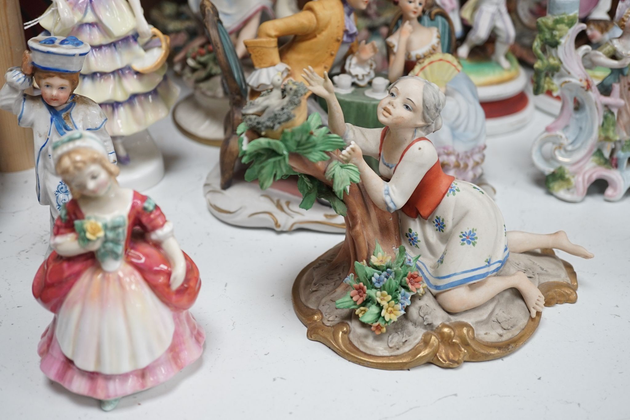 A quantity of various ceramic figures including two Doulton 'Valerie' and 'Meg', tallest figurative candlesticks 34 cms high.